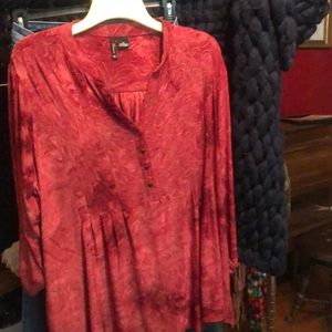 Curvy lady top.  Kinda cranberry ish red Christmas looking happy shirt.